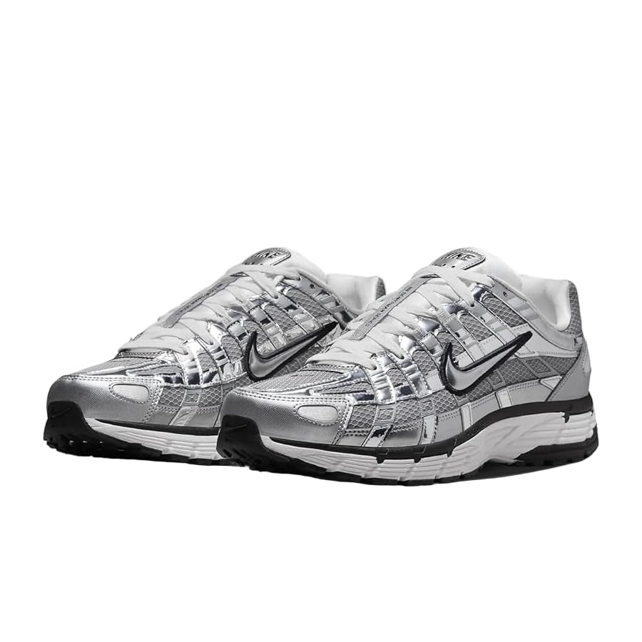 Pair of silver and black Nike running shoes on a white background