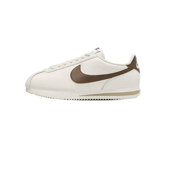 White sneaker with brown swoosh logo on a white background