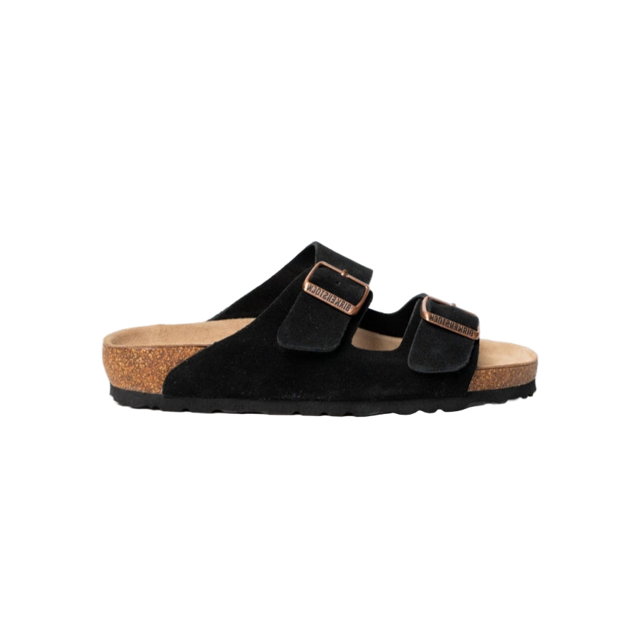 Black sandal with cork sole on a white background