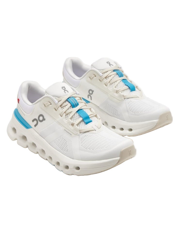 White running shoes with blue accents on a white background