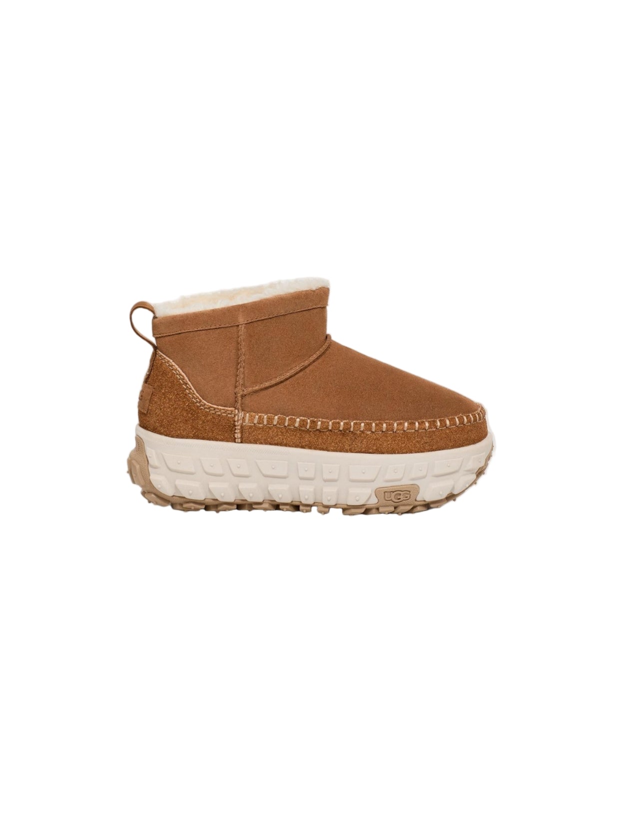 Brown suede boot with white sole on a light gray background
