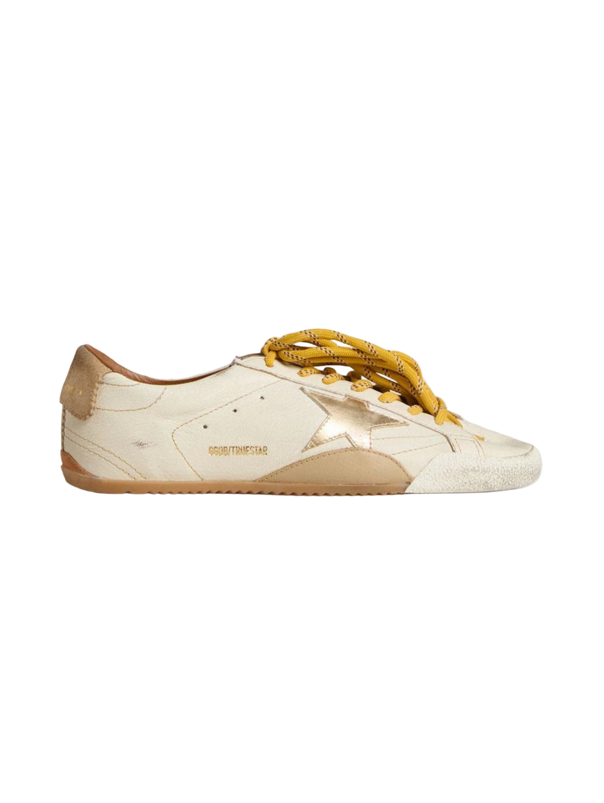 White and beige sneaker with yellow laces on a light gray background