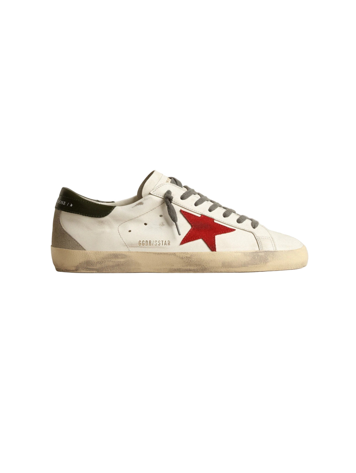 White sneaker with red star logo on a light gray background