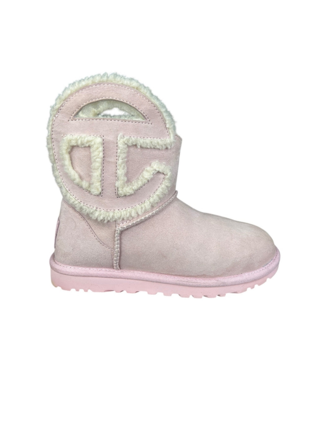 UGG x Telfar Logo Mini boot in pink suede and shearling.