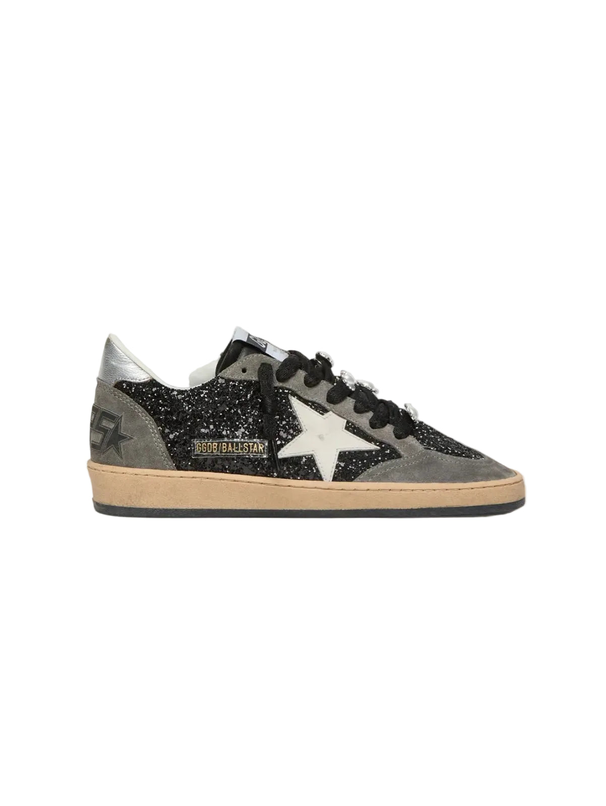 Gray sneakers with a star design on a light beige background