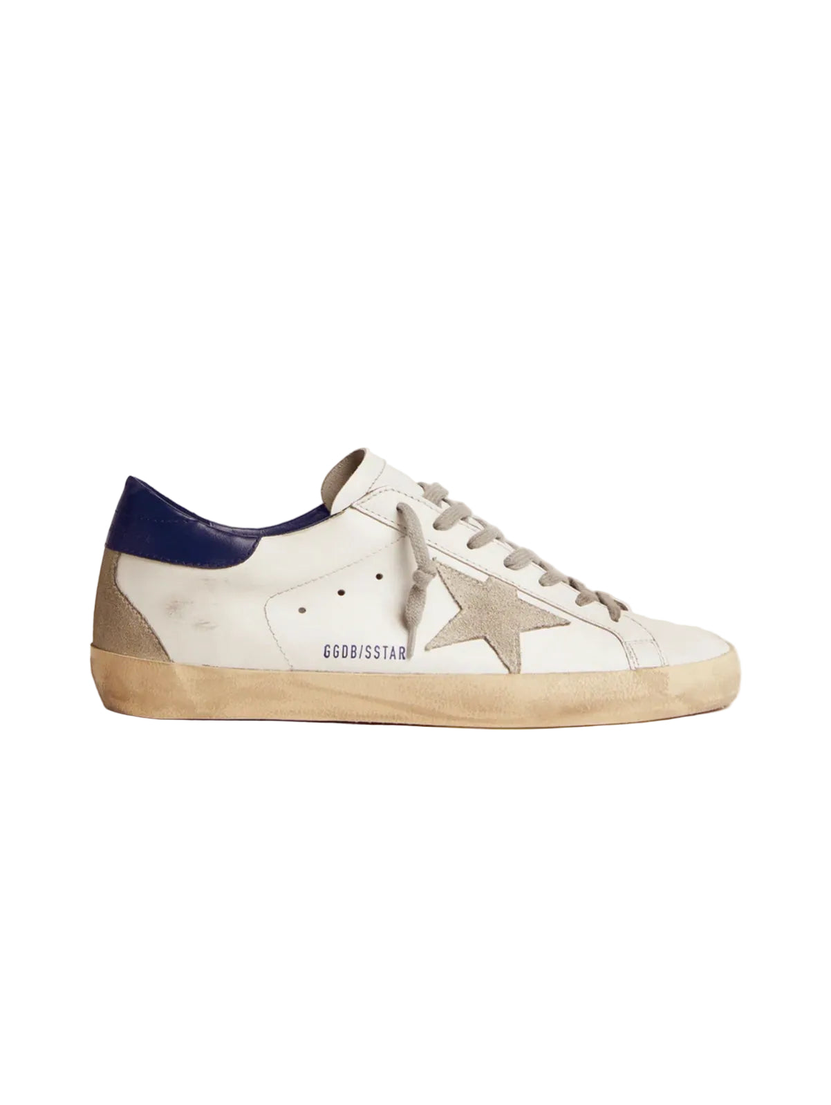 White sneaker with blue heel and star logo on a light beige background