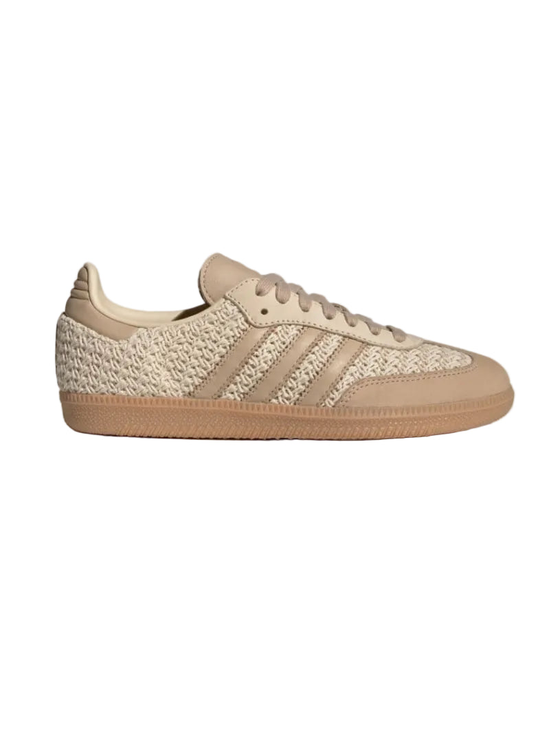 Beige sneaker with three stripes on a white background