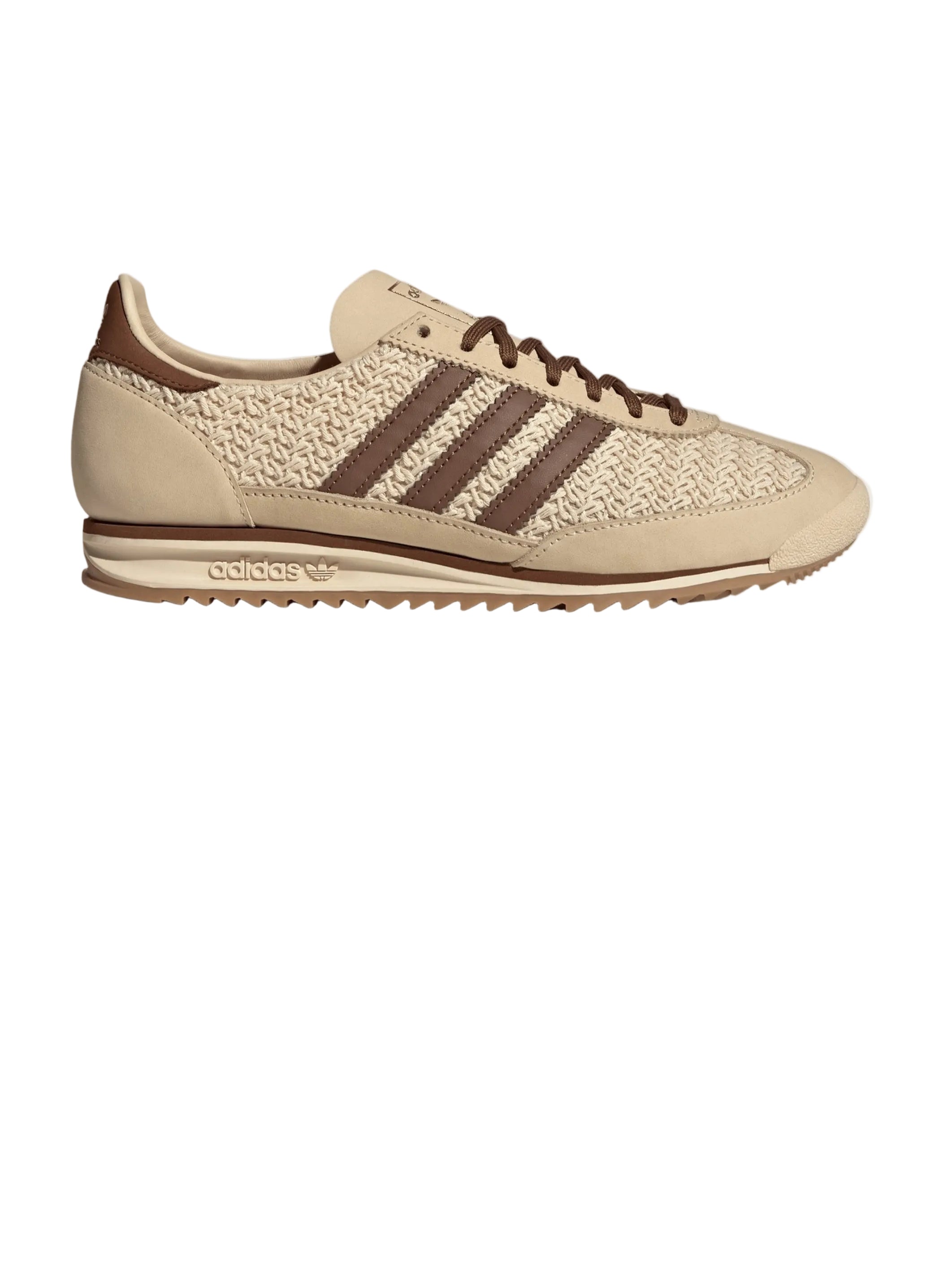 Beige sneaker with brown stripes on a white background