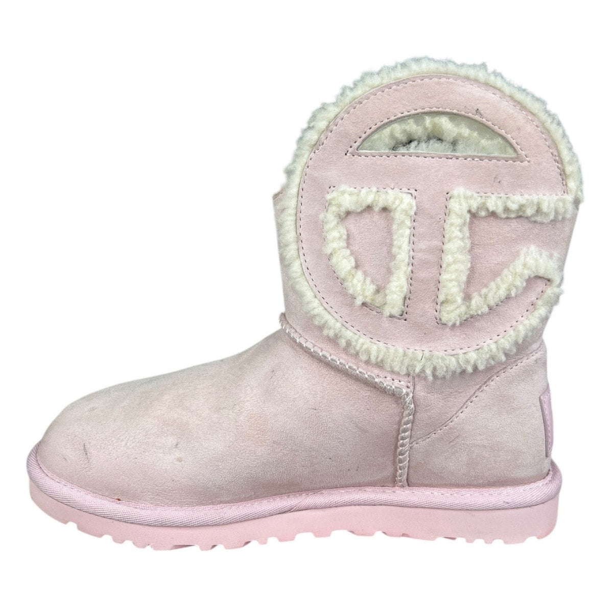 UGG x Telfar Logo Mini boot in pink suede and shearling.
