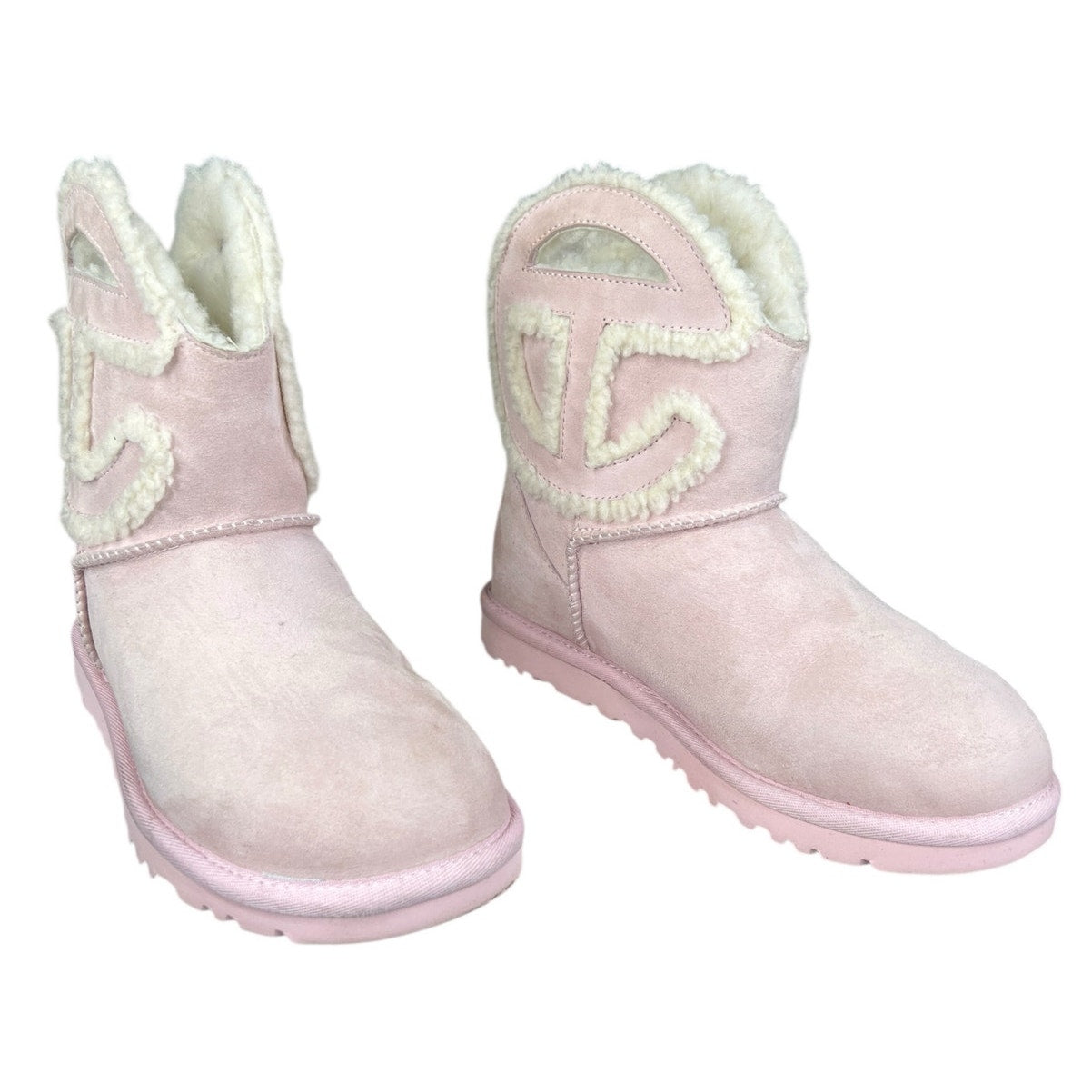UGG x Telfar Logo Mini boot in pink suede and shearling.